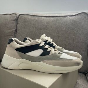 Fear of God Essentials Cream and Black Sneakers